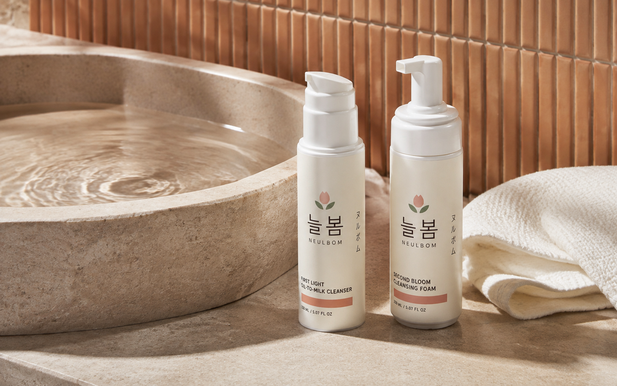 NEULBOM First Light and Second Bloom cleansers beside a stone basin