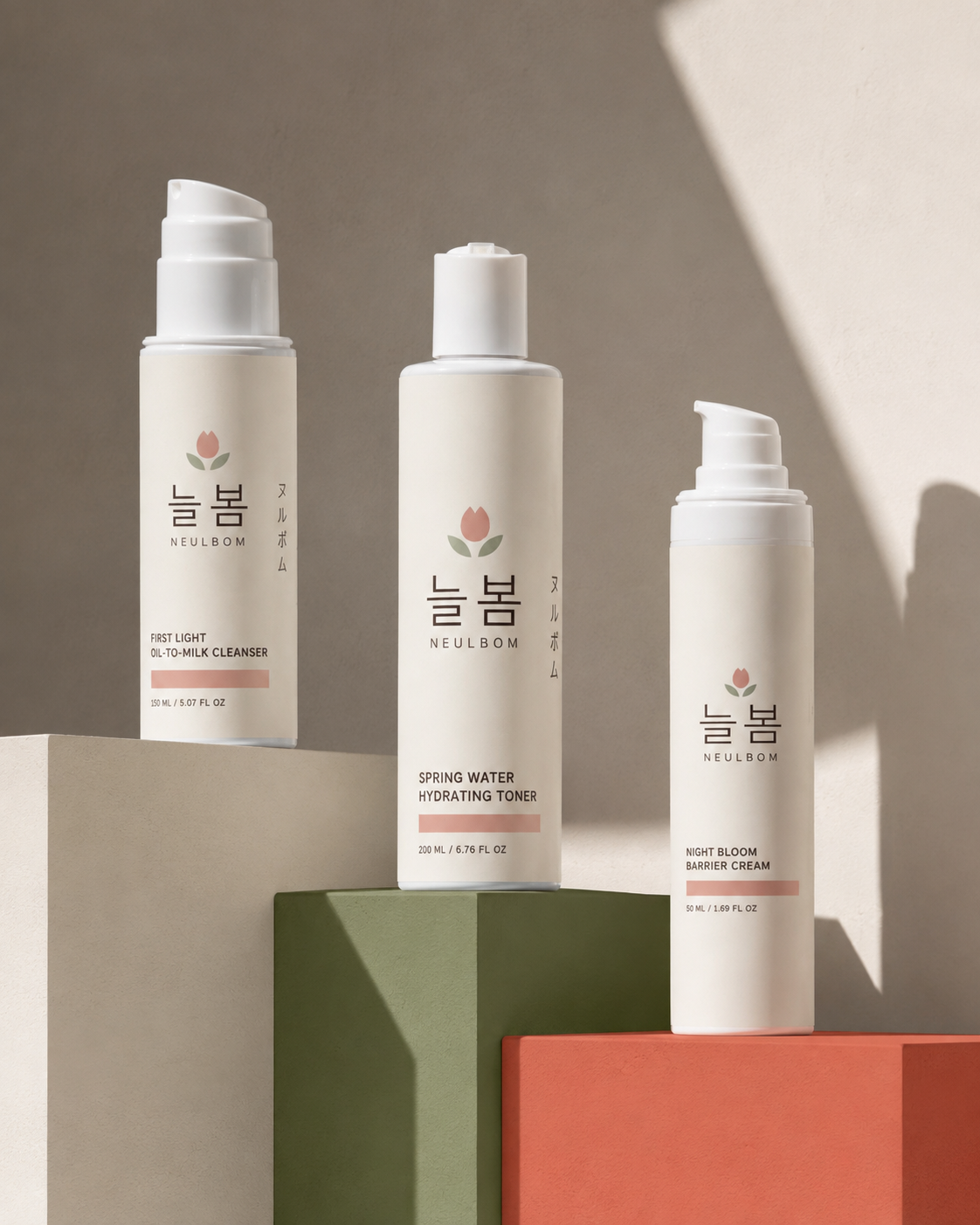 NEULBOM cleanser toner and night cream on sculptural coloured plinths